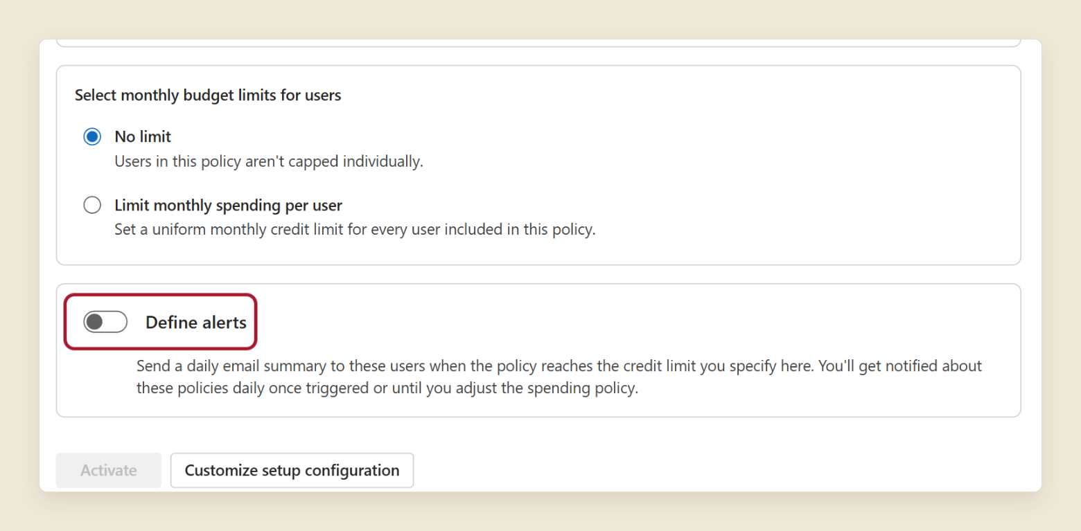 The bottom of the Activate the default spending policy panel. The Define alerts toggle is off and circled in red. Under it, the text says a daily email summary goes to chosen users when the policy reaches the credit limit you set. The Activate and Customize setup configuration buttons sit at the bottom.
